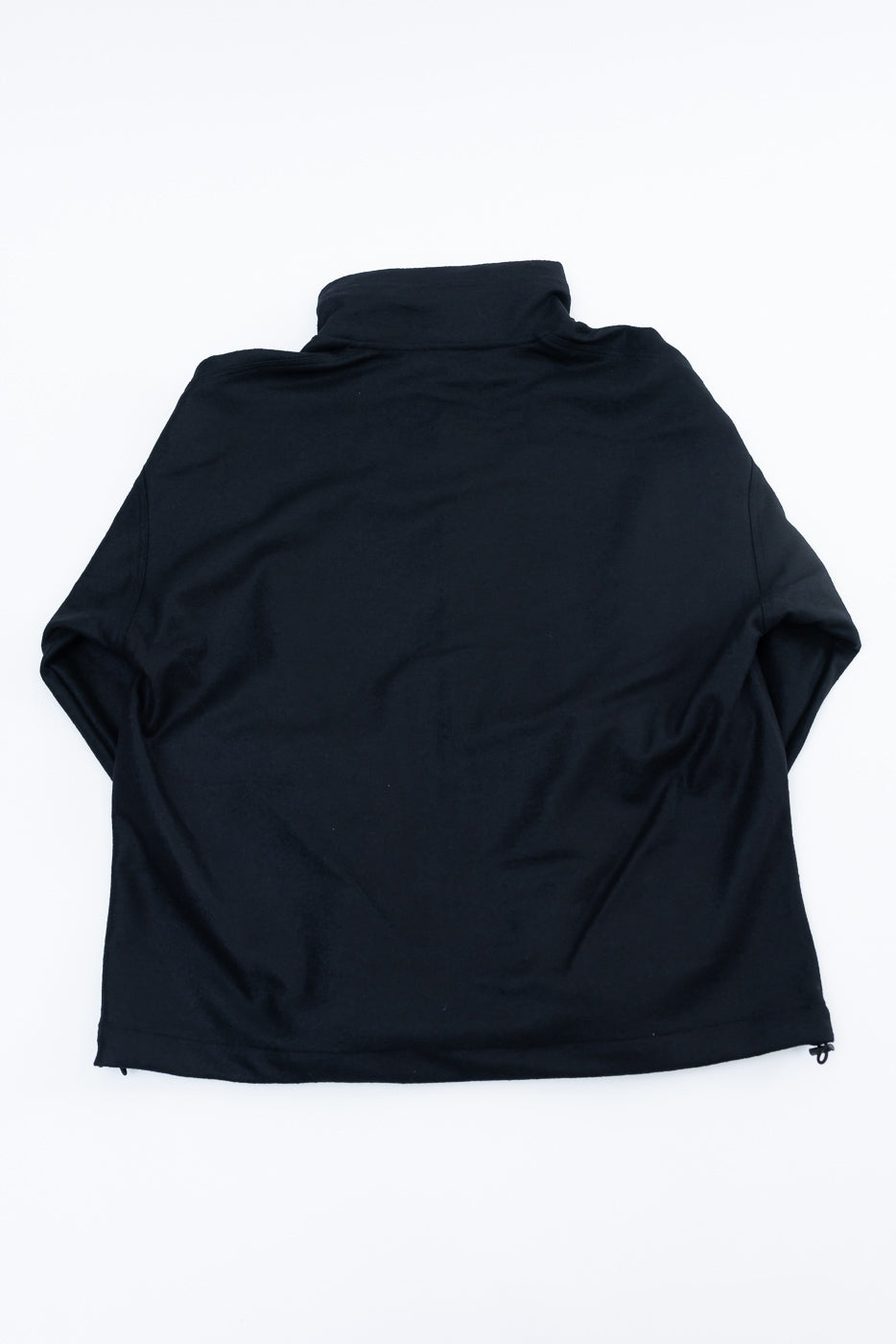 Flat lay of black wool stand neck jacket, back view, showing collar and straight hem.