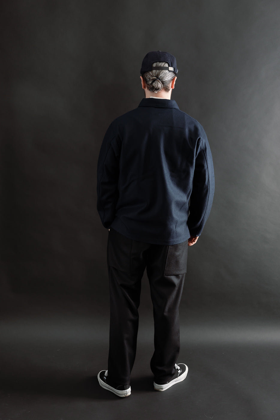 Full body rear view of male model 5'9