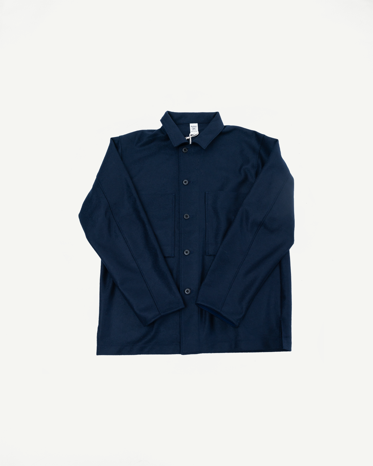 Flat lay front view of navy wool button-up shirt, showing chest pockets and collar details.
