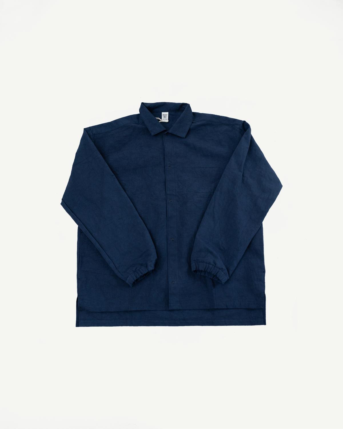 Navy blue long-sleeve shirt, front view, flat lay, button-up with collar and elastic cuffs