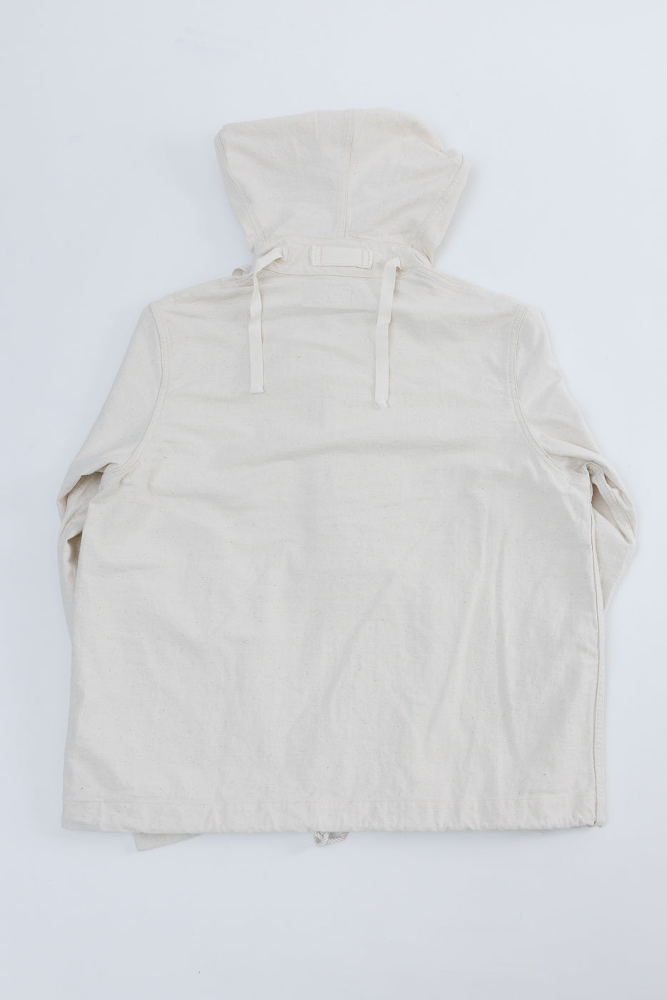 Flat lay of off-white sailor pullover parka, back view showing hood and drawstrings