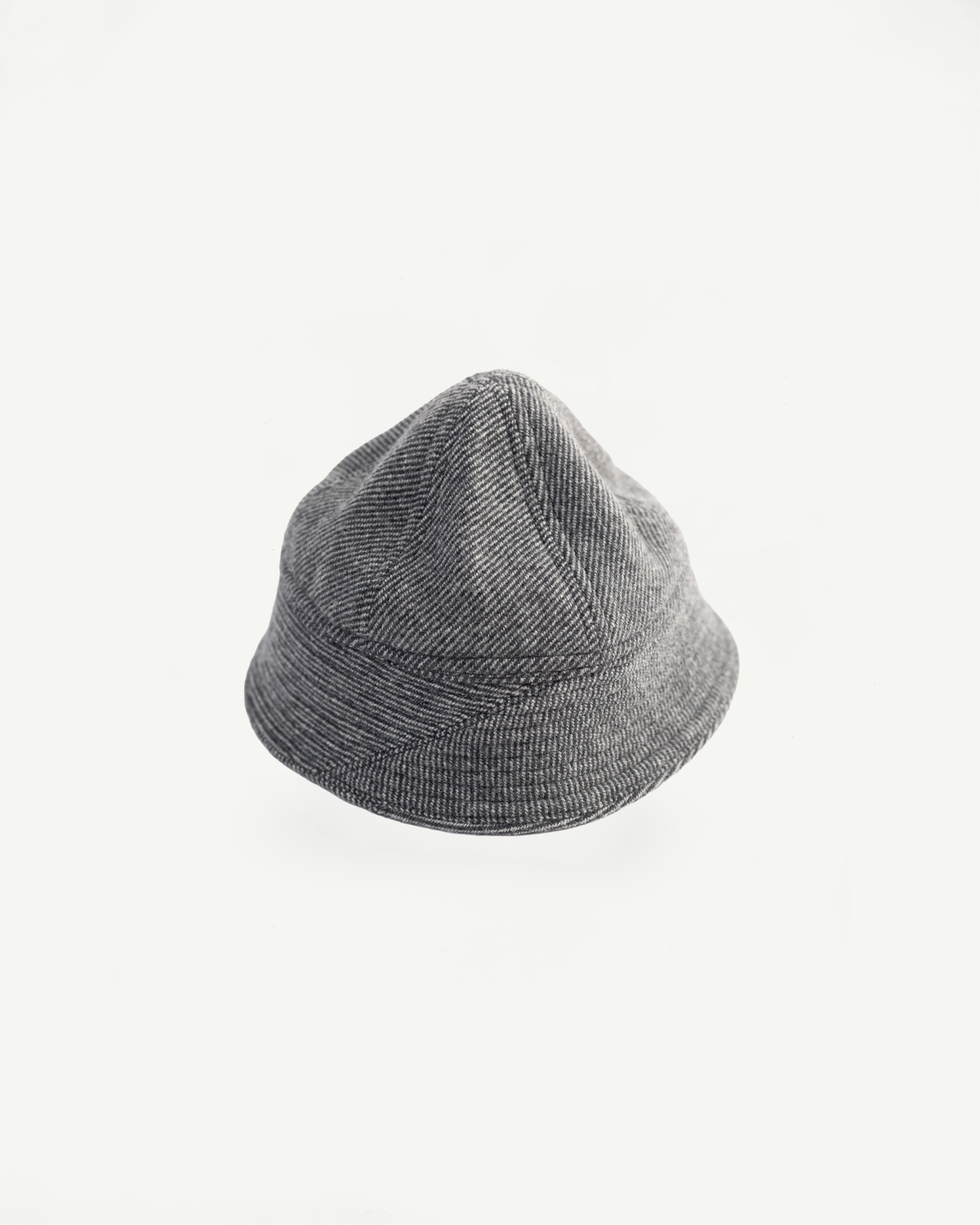 Close-up top view of gray tweed prison cap, textured fabric, flat lay, front side, Dant