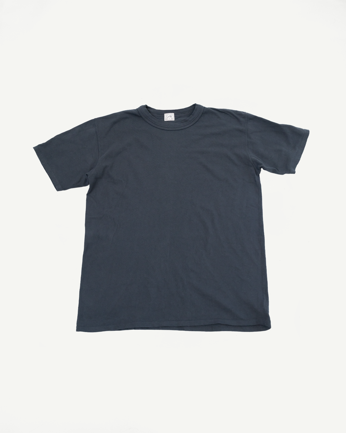 Front flat lay of dark gray crewneck t-shirt with tag detail, ribbed collar, and hem