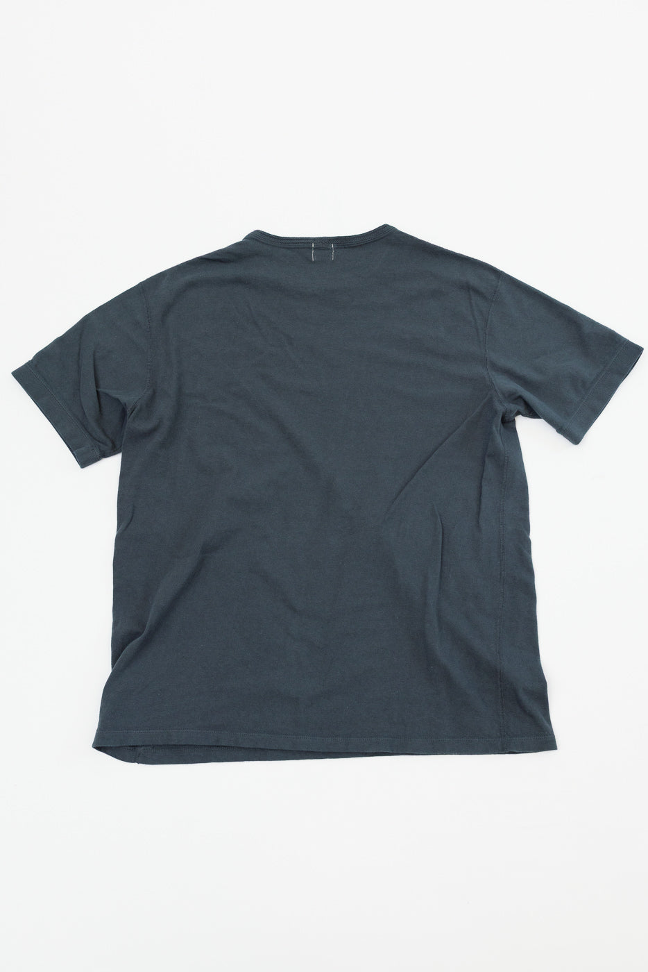 Back view of dark gray short-sleeve t-shirt, flat lay, showing hem and neckline details