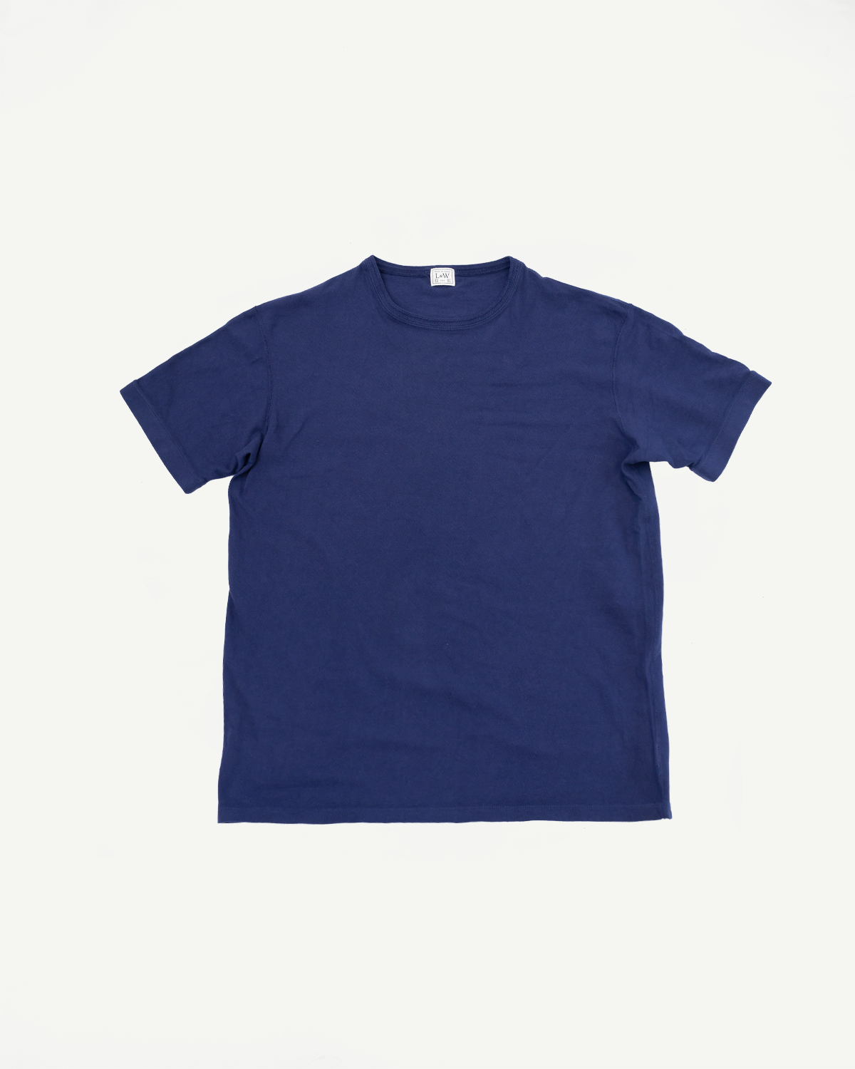 Navy blue crew neck t-shirt front view, ribbed collar, short sleeves, flat lay