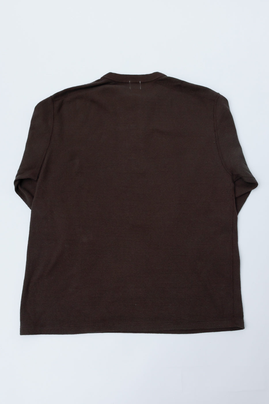 Flat lay showing back of oak brown honeycomb knit Henley long sleeve thermal shirt