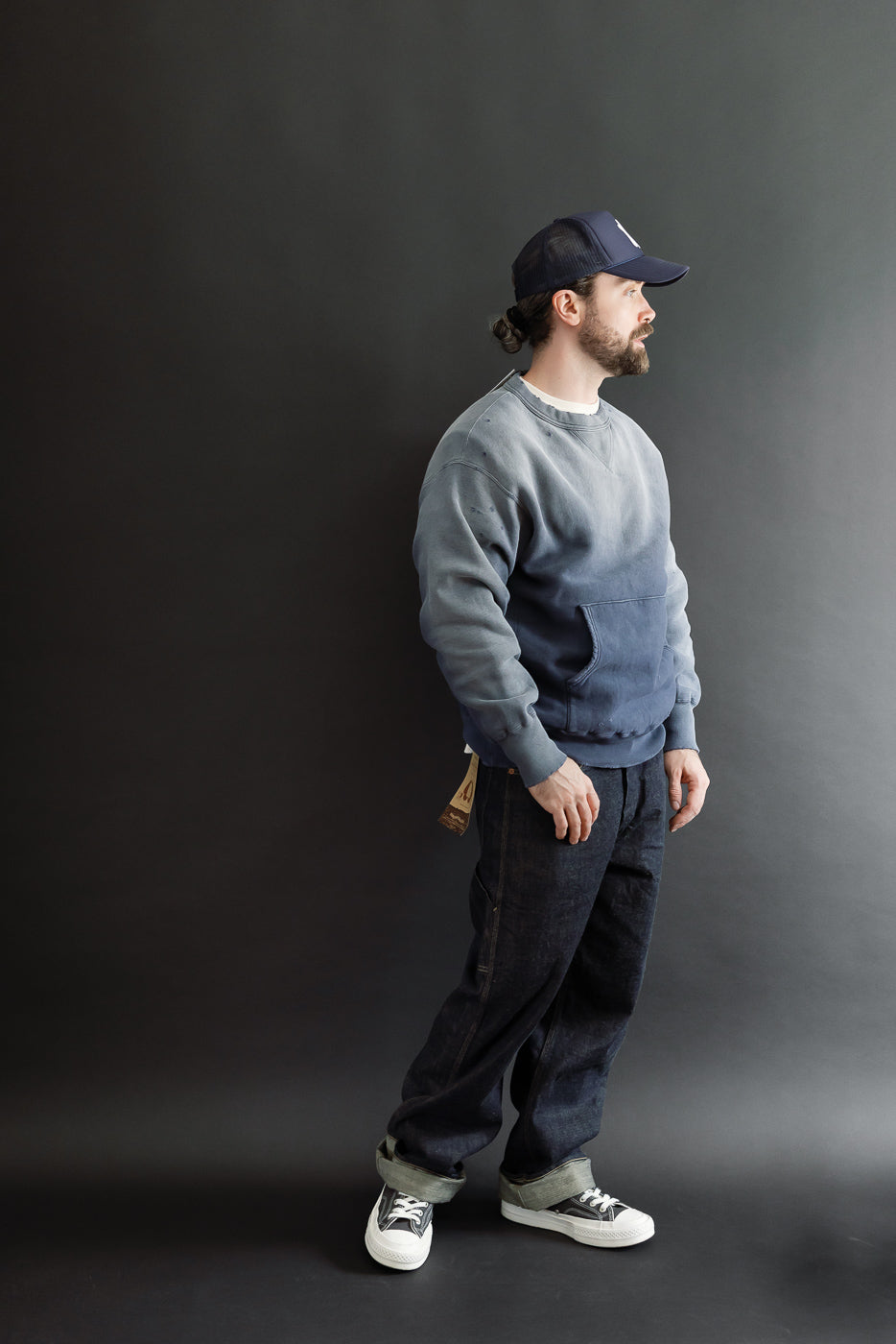 Full body side view of a male model, 5'9