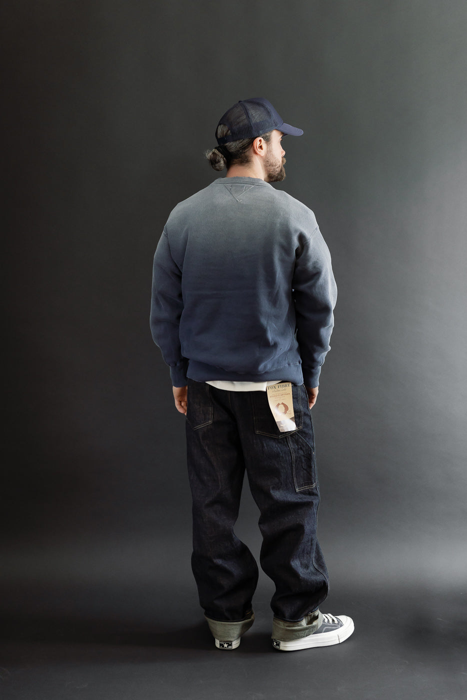 Back view, full body of a male model (5'9