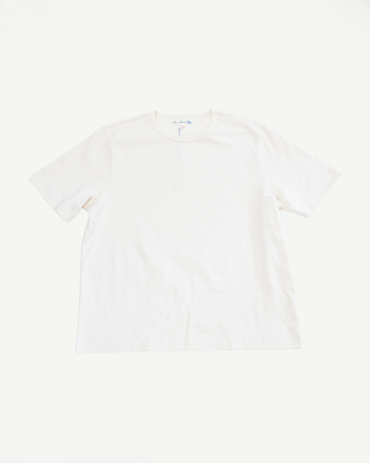 Front view flat lay of a white short sleeve crew neck t-shirt.
