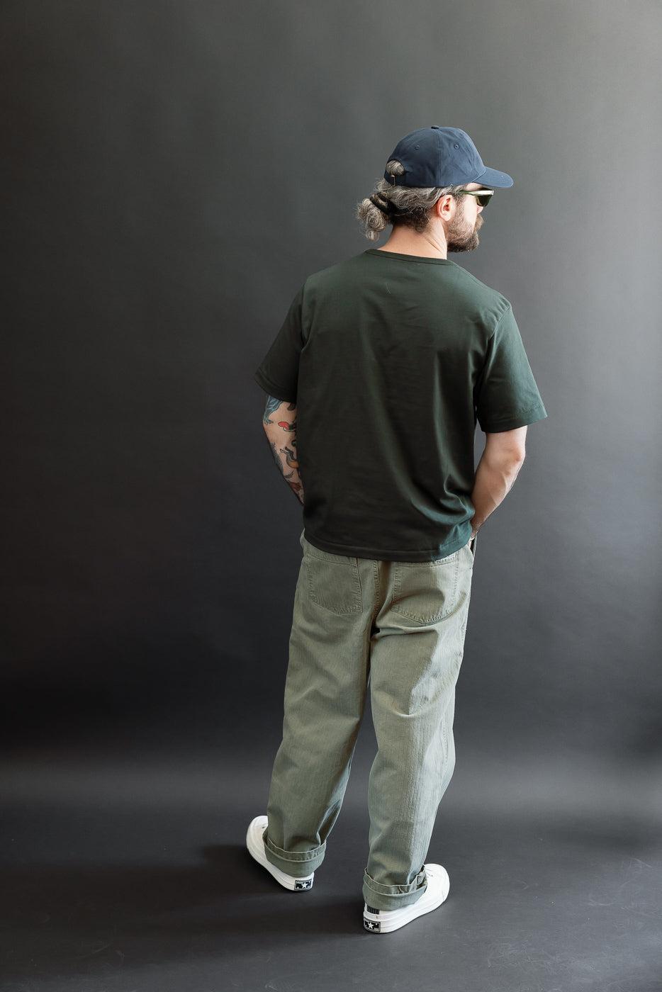 Back view, full body of a male model (5'9