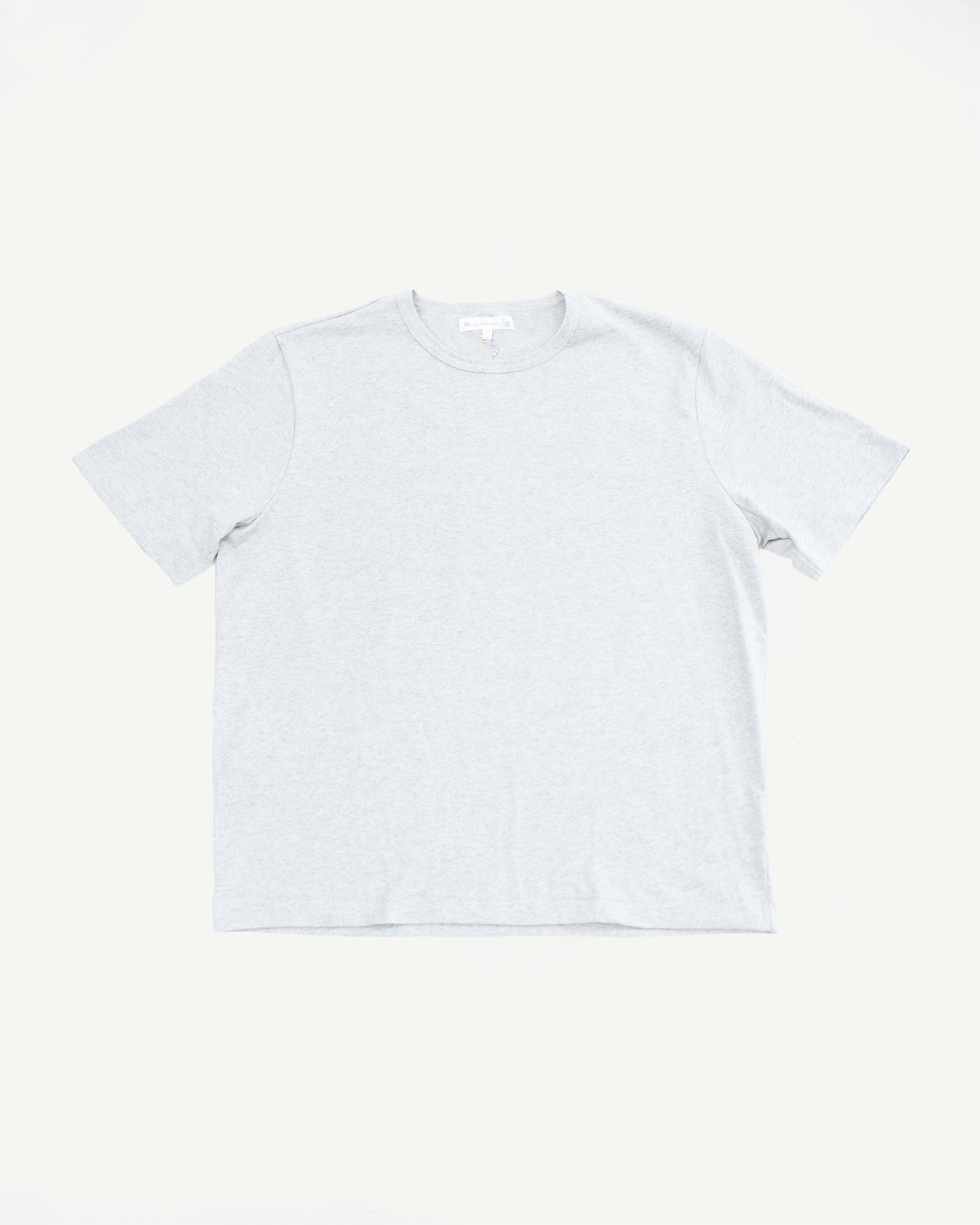 Flat lay of the front of a white short-sleeve t-shirt with a crew neck collar.