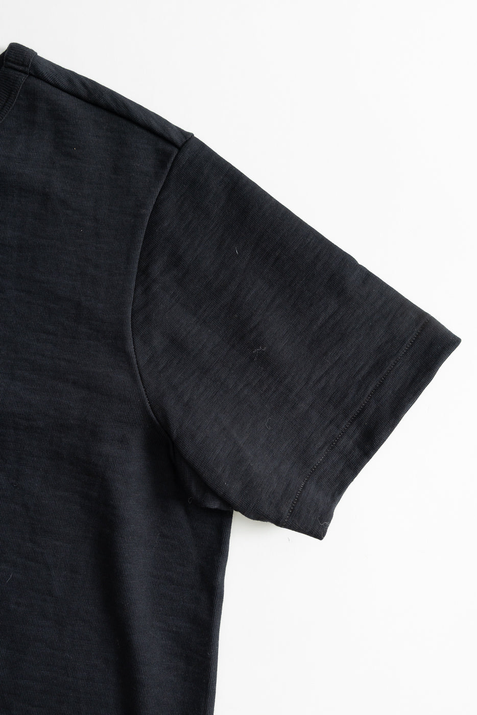 Close-up of right sleeve and shoulder, flat lay, loopwheeled charcoal heavy T-shirt
