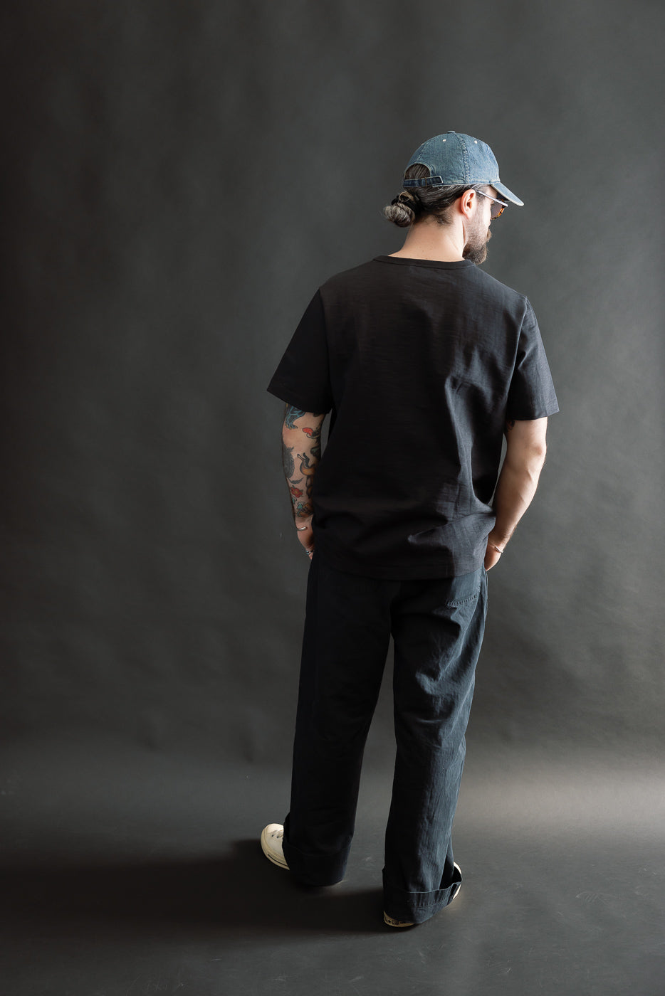 Full body rear view of male model 5'9