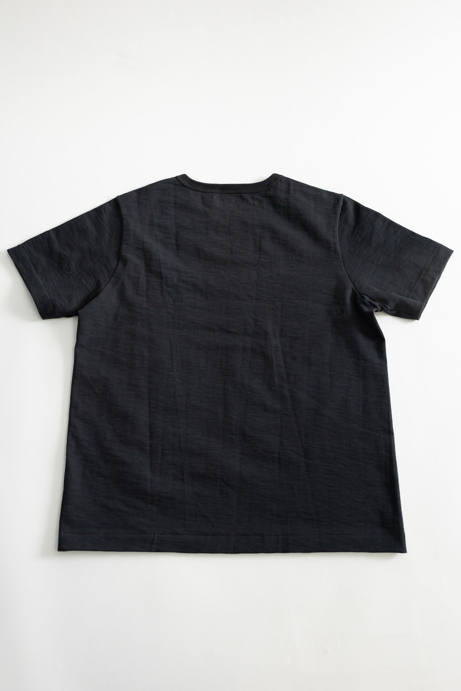 Flat lay of charcoal loopwheeled heavy t-shirt, back view, short sleeves, relaxed fit