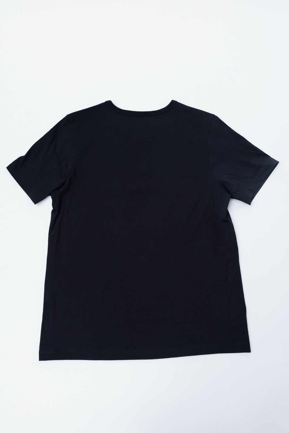 Flat lay of Merz b. Schwanen deep black T-shirt, back view, classic fit, short sleeves