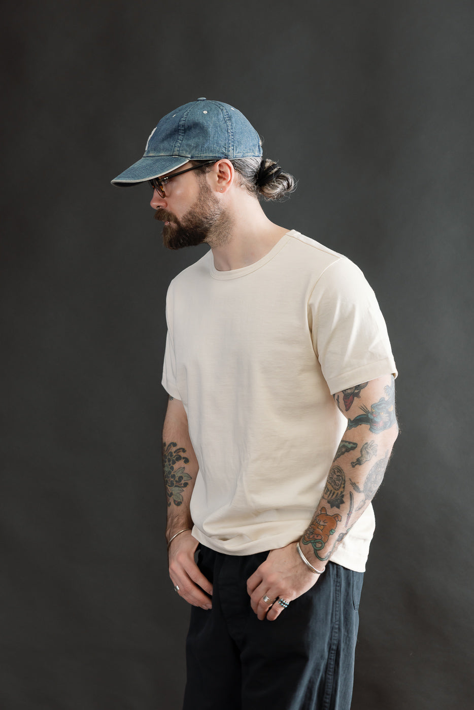 Side view, mid-length shot of male model 5'9