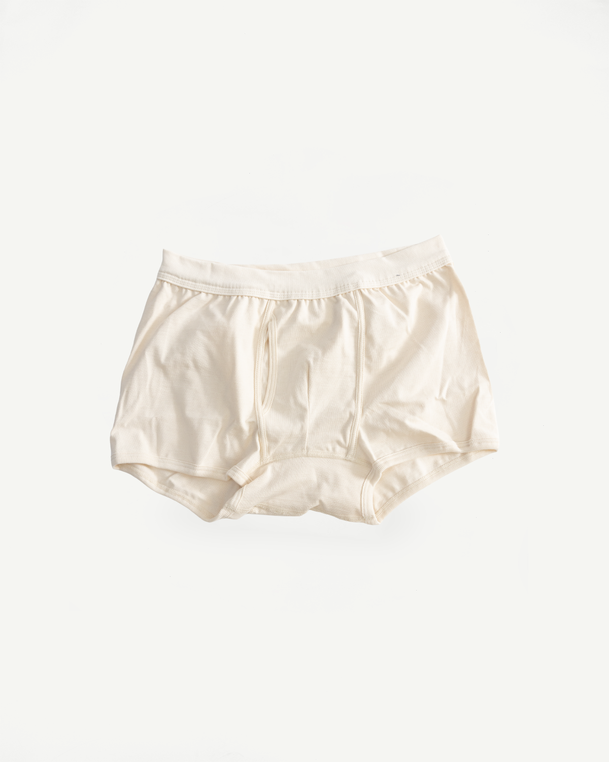 254.02 - Loopwheeled Boxer Brief in Nature, crafted from 100% organic cotton with a higher brief cut and keyhole feature, laid flat against a white background, showcasing premium men's undergarments.