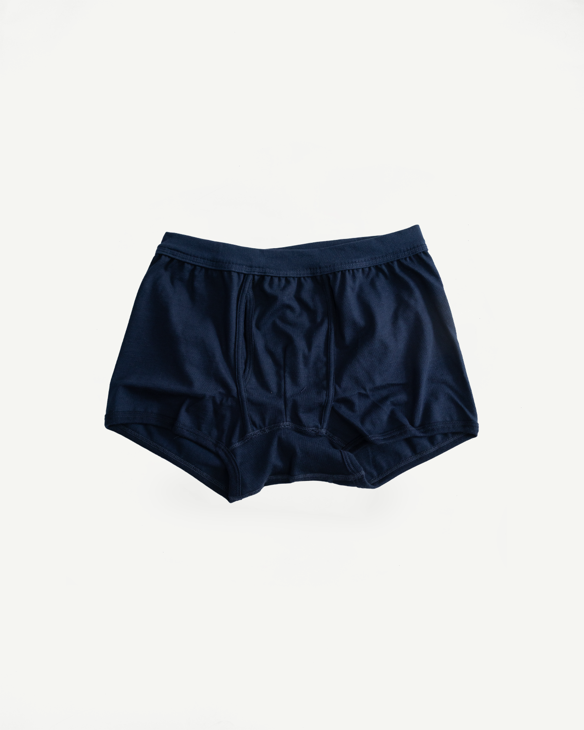 254.66 - Loopwheeled Boxer Brief - Ink Blue, featuring a dark navy color, crafted from soft, breathable organic cotton with a comfortable elastic waistband, laid flat against a white background.