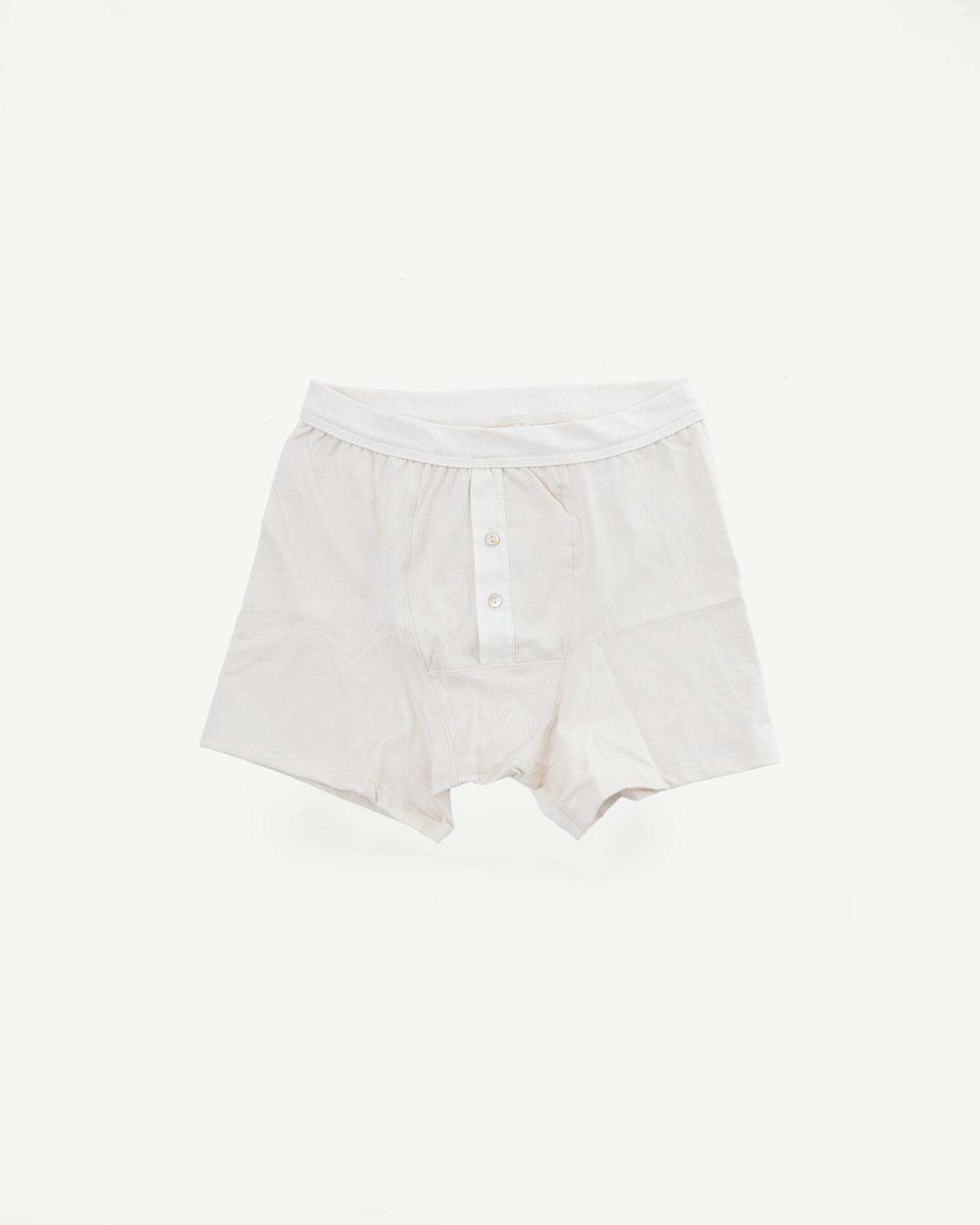 Flat lay of men's loopwheeled boxer shorts, front view showing button fly and elastic waistband.