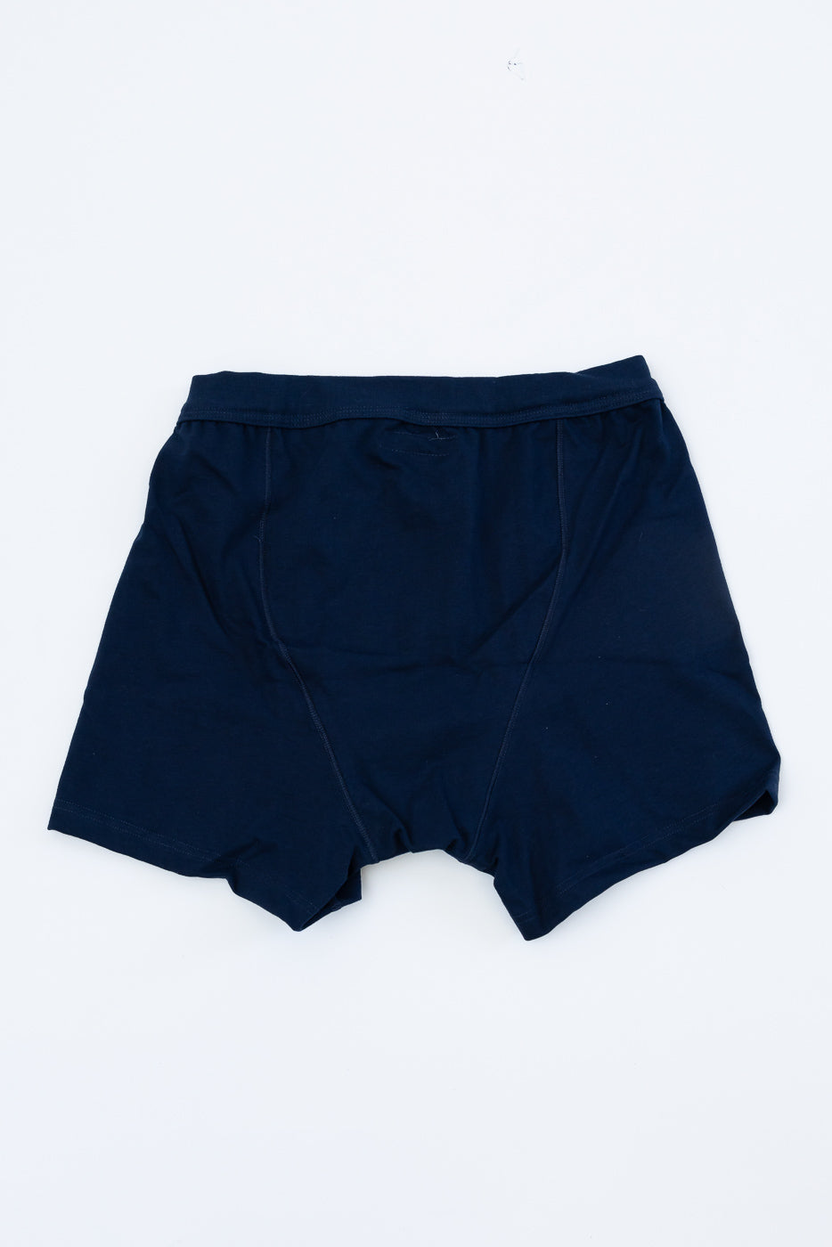 Navy-blue 255.66 - Loopwheeled Boxer Button Fly briefs laid flat, showcasing their longer, roomier leg fit. Made from 100% organic cotton with a Mother of Pearl button placket for durability.