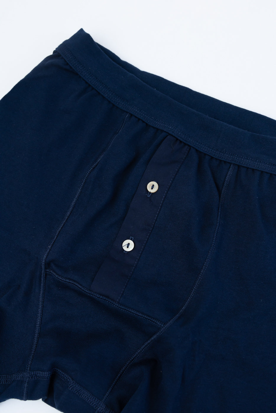 255.66 - Loopwheeled Boxer Button Fly - Ink Blue, showcasing navy-blue boxer-style underwear with an elastic waistband and two-button fly, crafted from 100% organic cotton for comfort and durability.