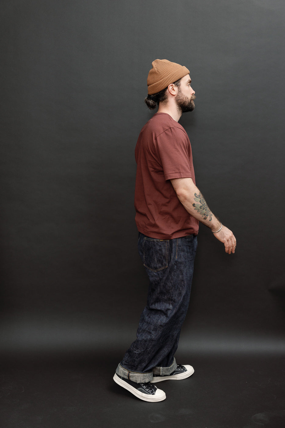 Full body side view of a male model, 5'9