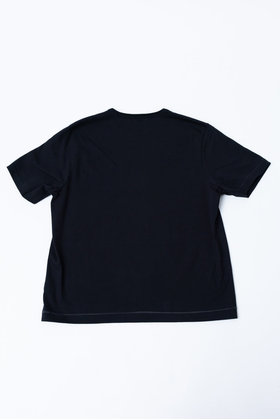 Back view of a plain black short-sleeve t-shirt flat lay.