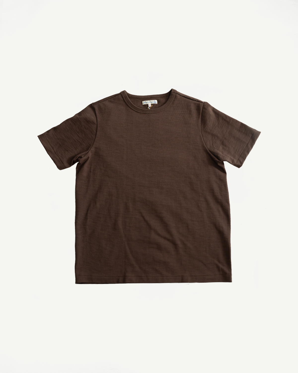 Flat lay of chocolate brown heavy T-shirt, front view, showing short sleeves and crew neck.