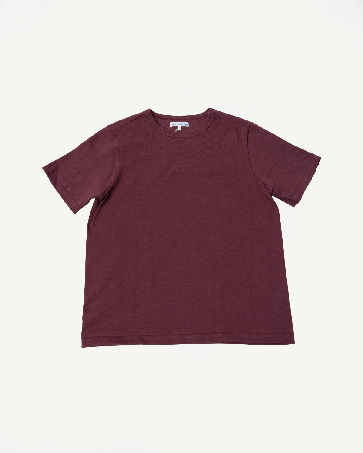 Front view flat lay of a burgundy crewneck short sleeve t-shirt.