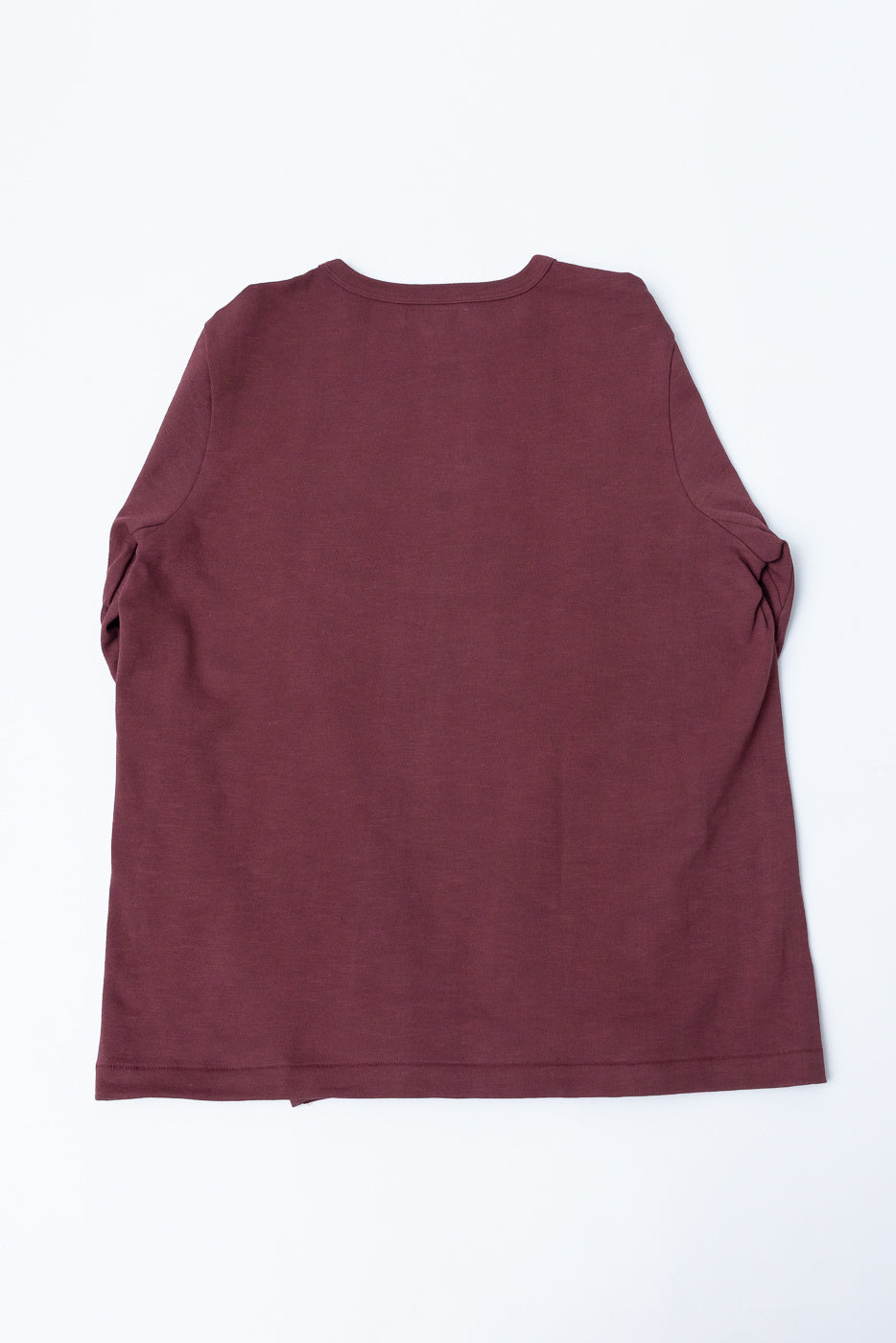 Flat lay of the back of a burgundy long-sleeve t-shirt.