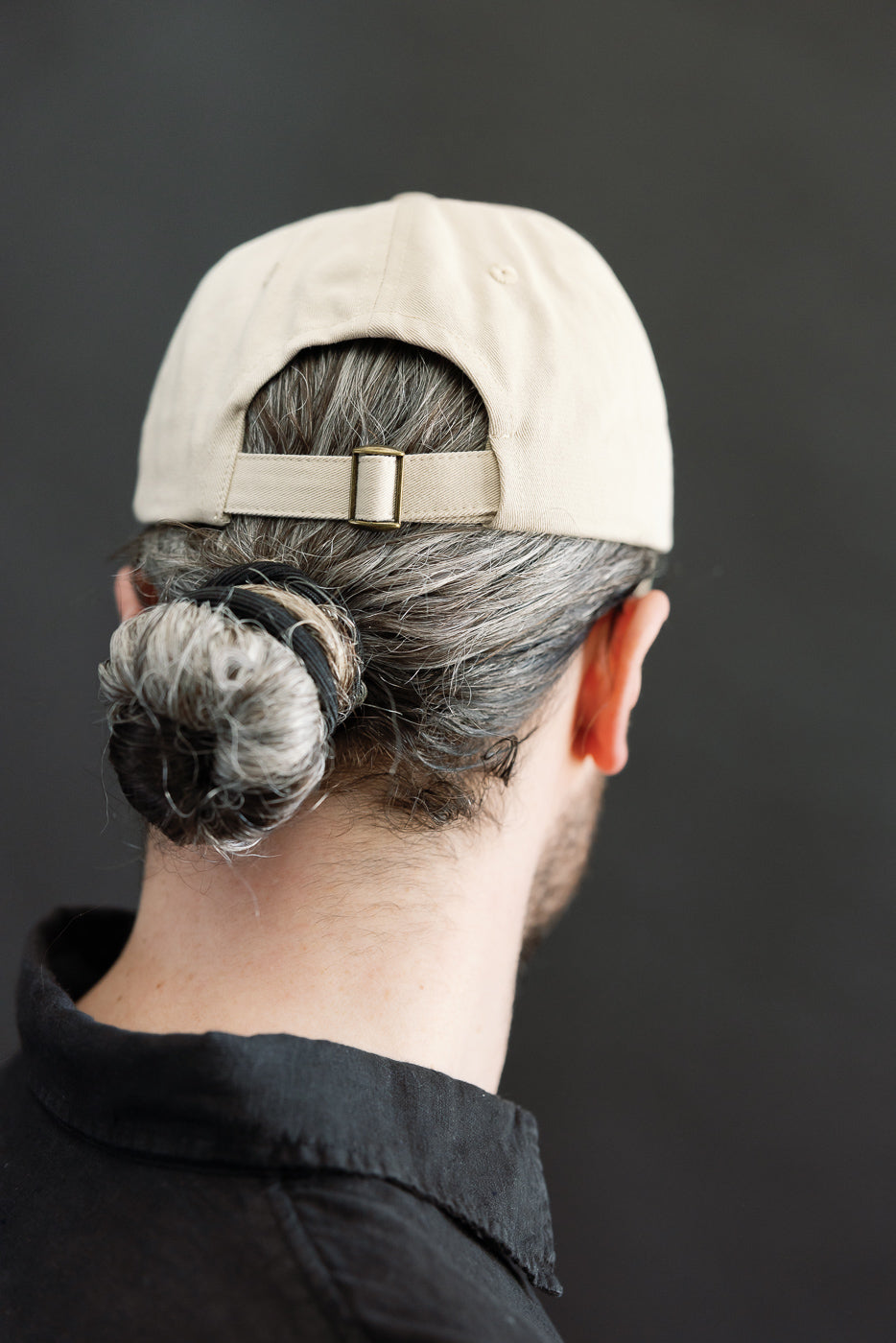 Close-up of back view, light khaki cotton twill cap on male model, 5'9