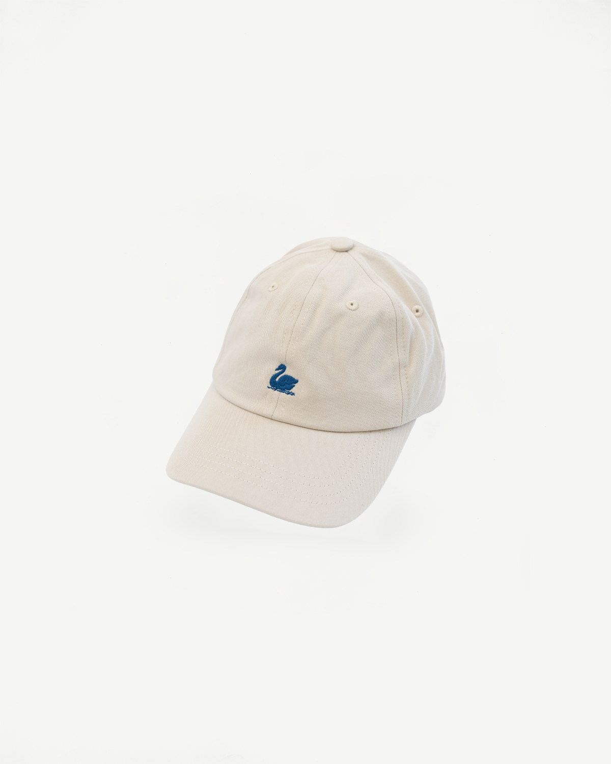 Front close-up of light khaki cotton twill cap with blue swan logo embroidery.