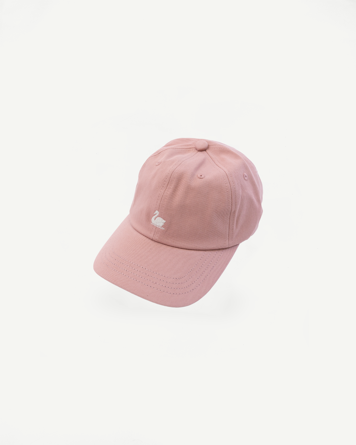 Front view flat lay of rose cotton twill cap with white swan logo embroidery.