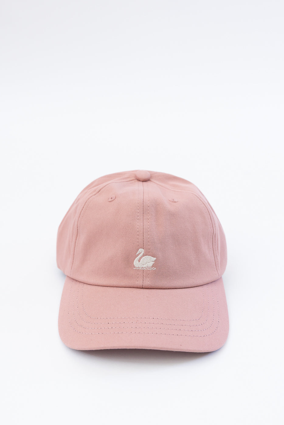 Close-up front view of rosewood cotton twill cap with white swan logo embroidery.