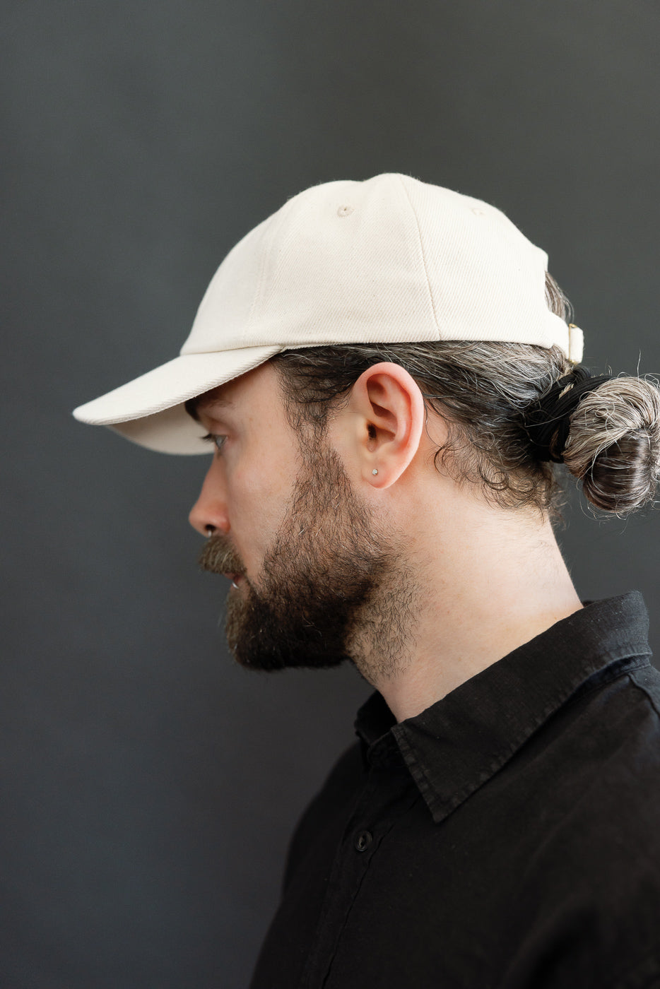 Close-up side view of male model 5'9