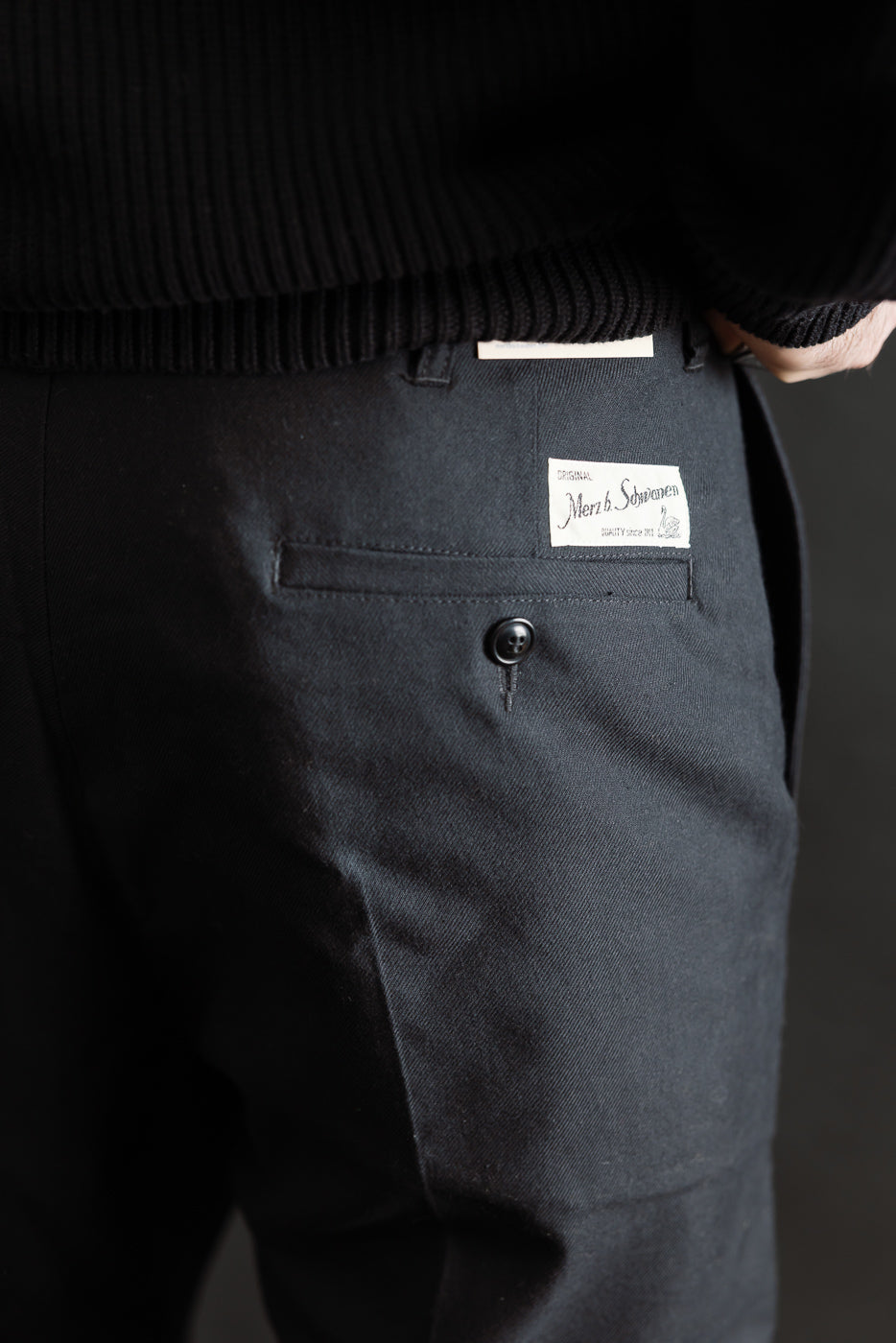 Close-up of back right side of deep black wool-cotton chino on 5'9