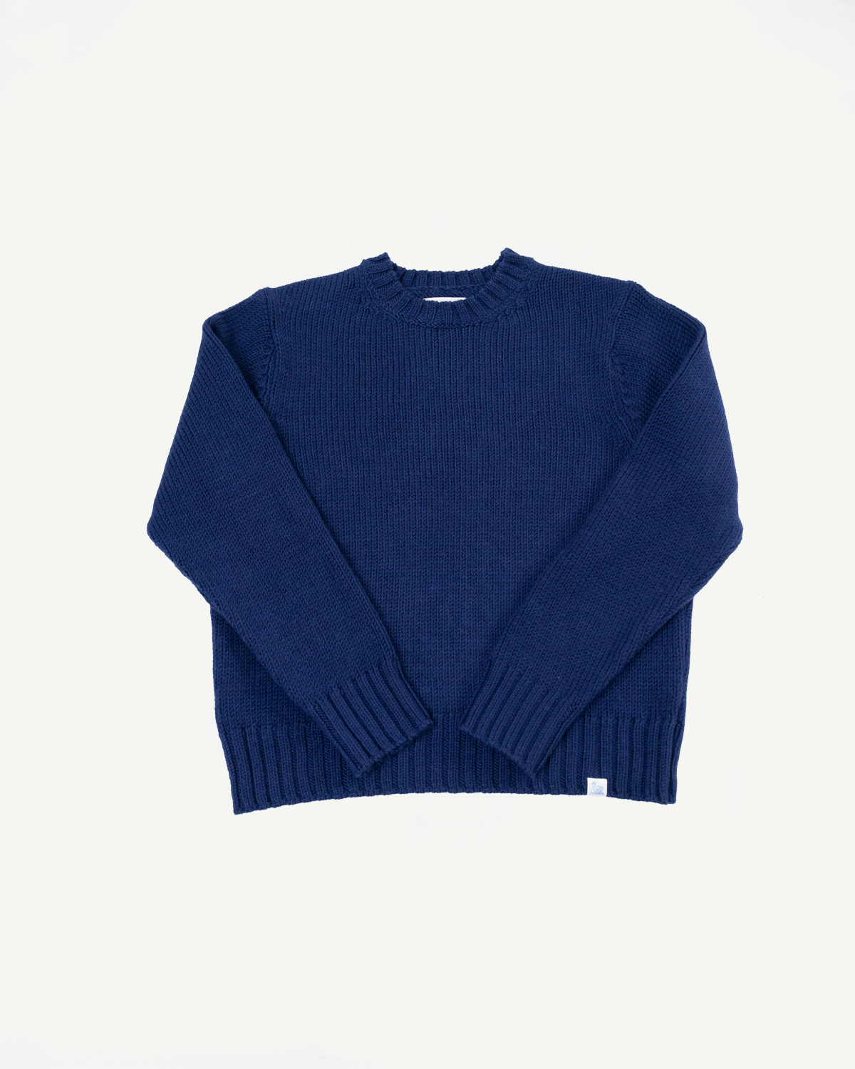 Front view flat lay of a navy blue ribbed knit crewneck sweater.