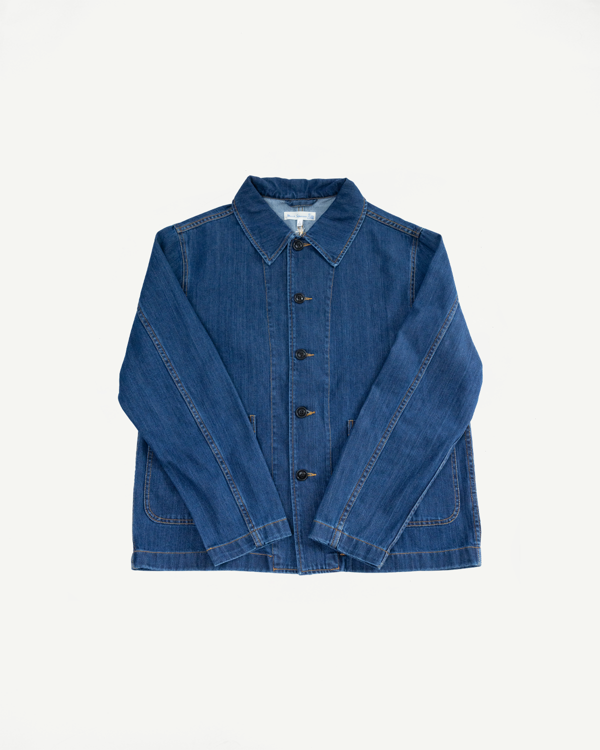 JKT08DN.520MB - Cropped Worker's Denim Jacket features a classic collar, corozo nut buttons, and two front patch pockets. Made from 11.3oz organic cotton denim with a vintage dark stone wash.