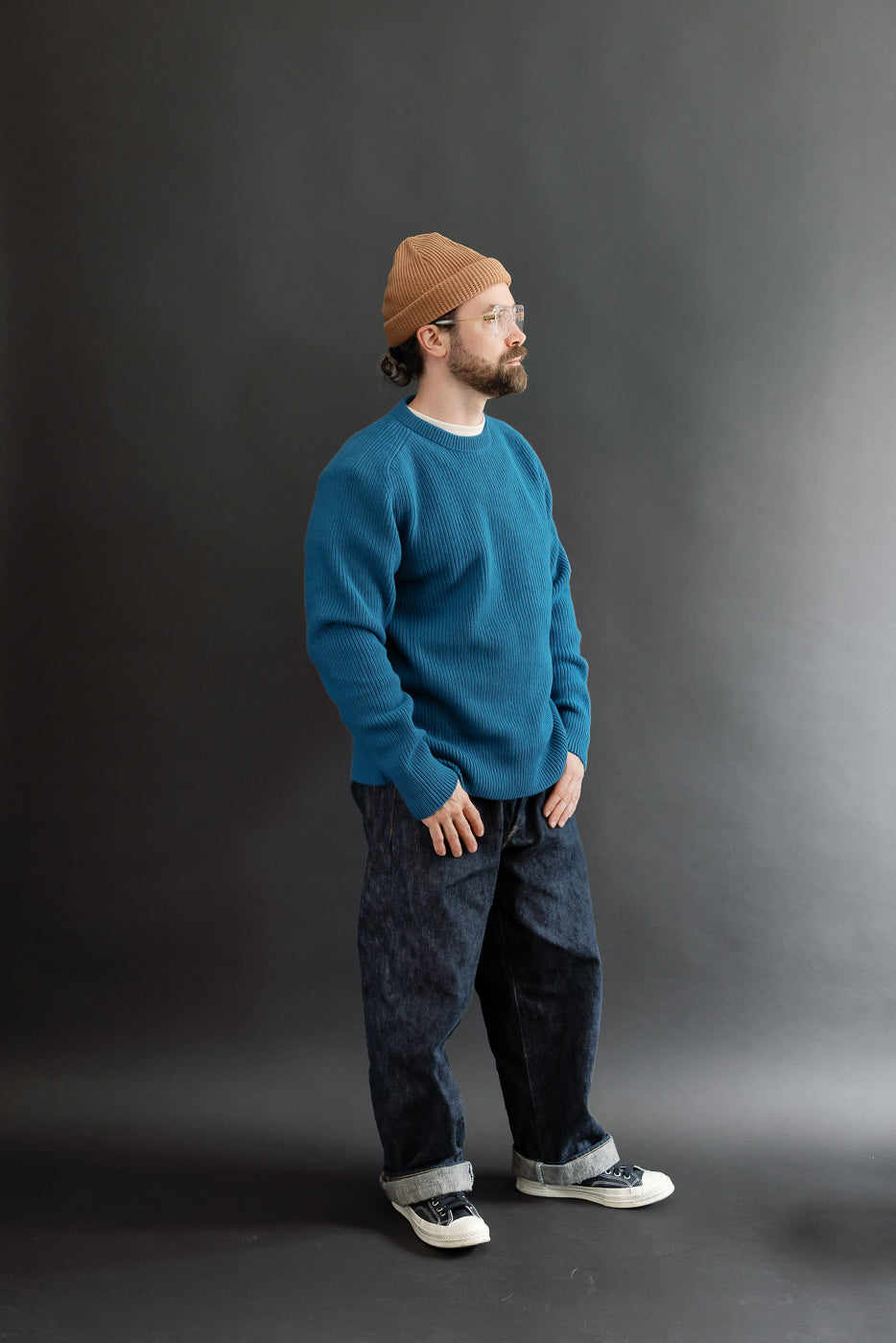 Full body side view of a male model, 5'9