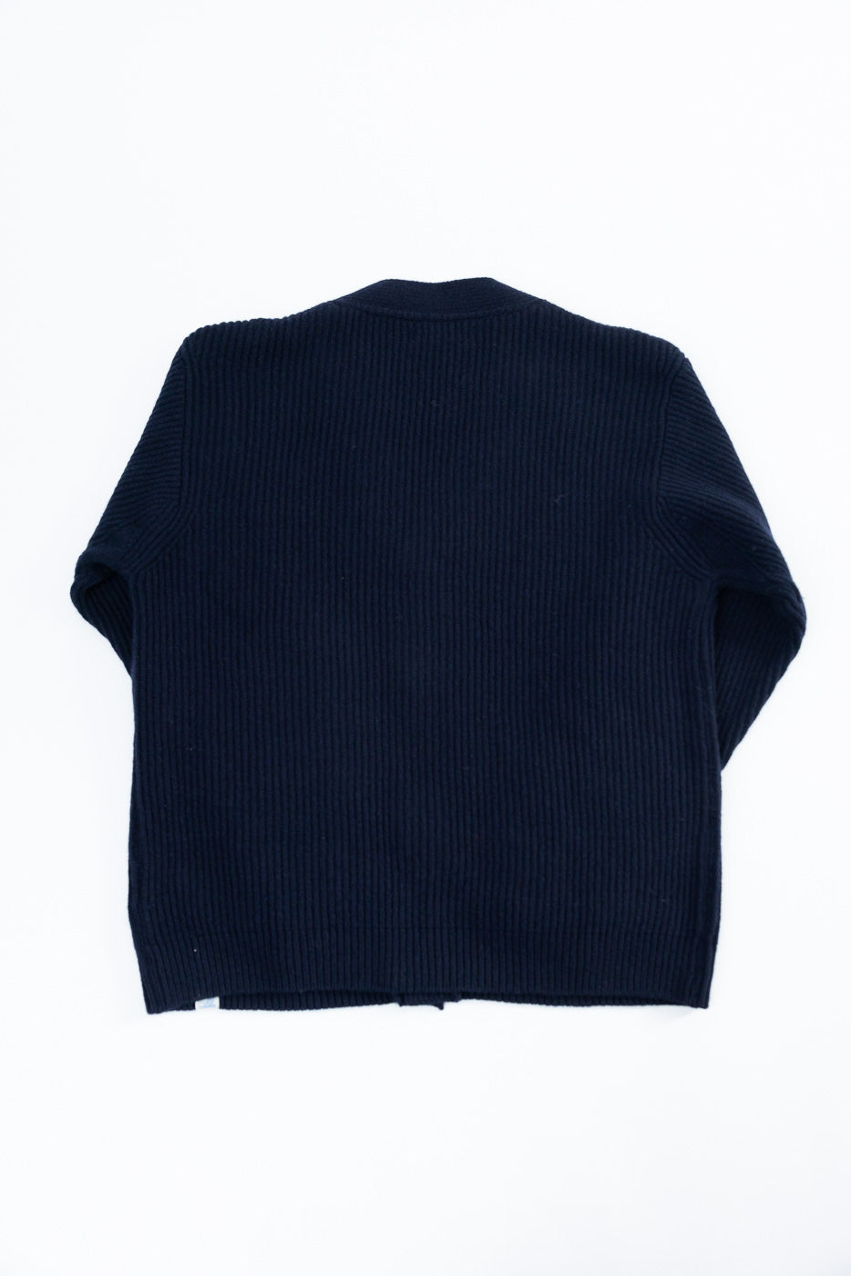 Back view flat lay of Merz b. Schwanen navy merino wool cashmere cardigan, ribbed texture