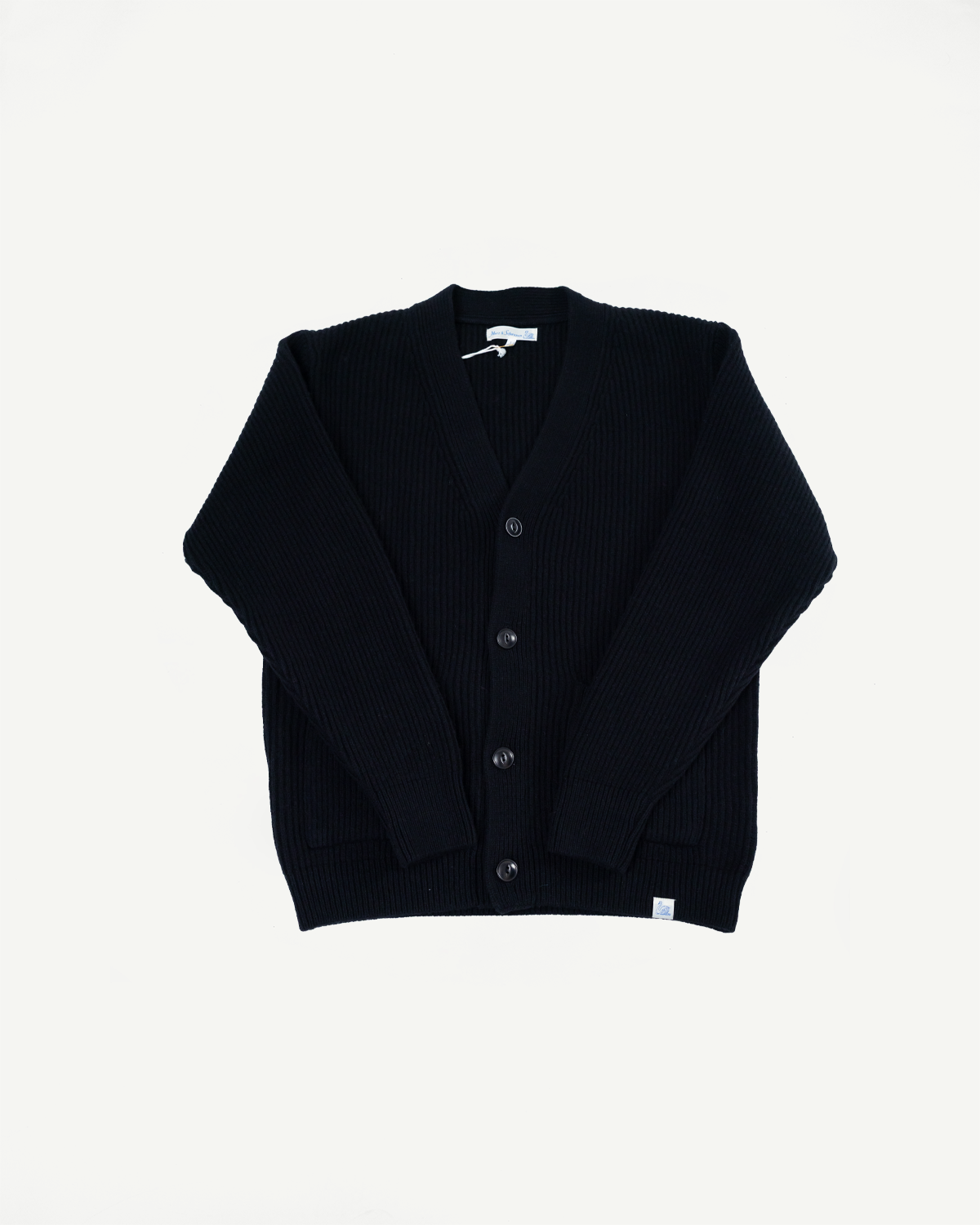 Front view flat lay of a navy blue ribbed knit cardigan with a V-neck and buttons.