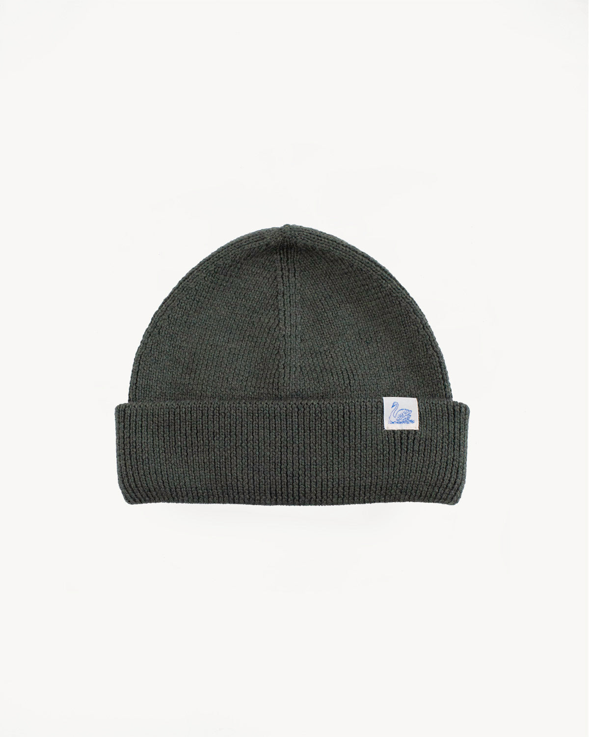 Front flat lay of ribbed army green Merz b. Schwanen watch cap with logo tag, knit texture.