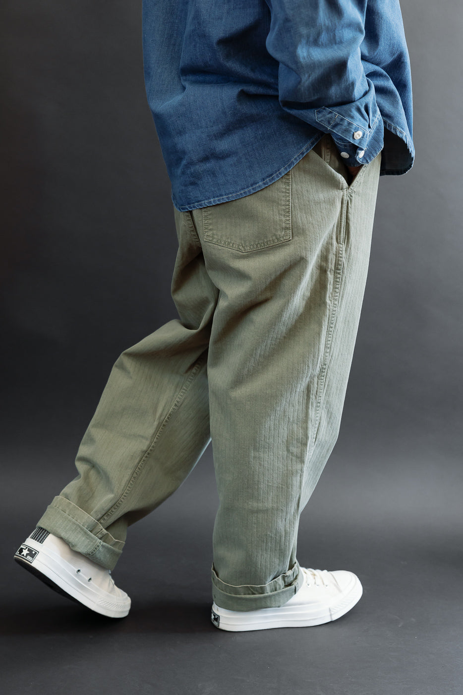 Side view of olive pants on a male model, 5'9