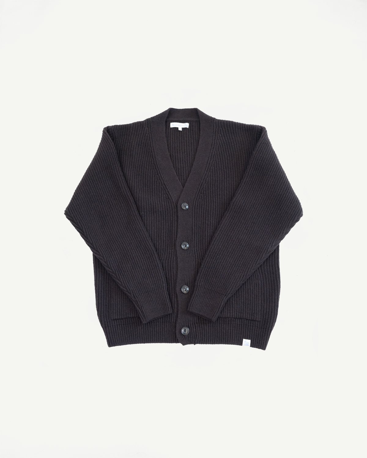 Front view flat lay of a dark ribbed knit cardigan with button closure.