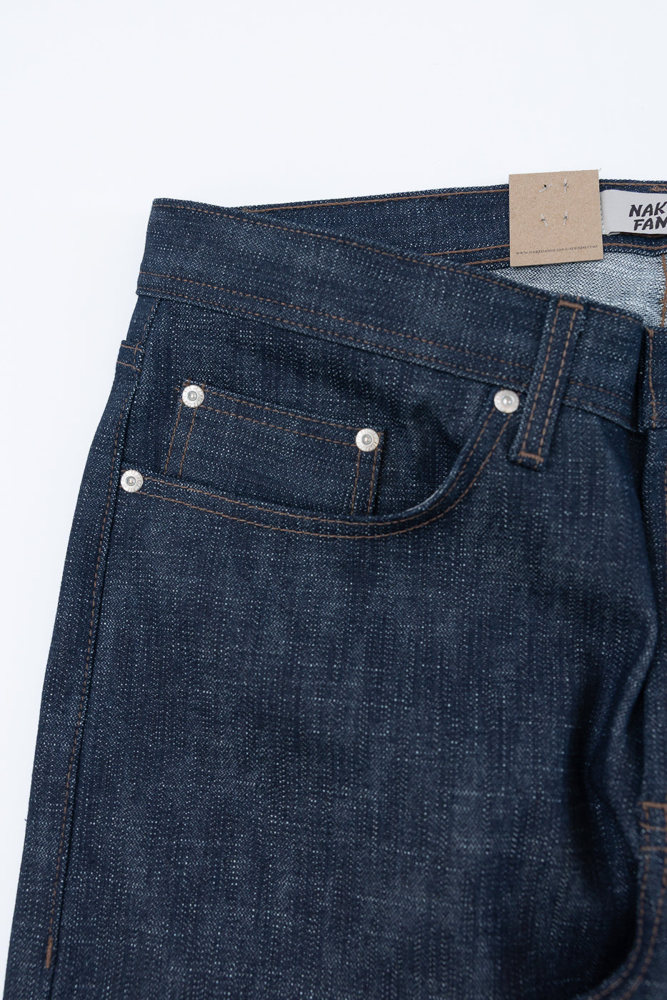 12.5oz - Greencast Stretch Selvedge - Weird Guy denim jeans show a dark indigo upper front with a waistband, belt loop, metal rivets, main pocket, coin pocket, and visible contrast stitching.