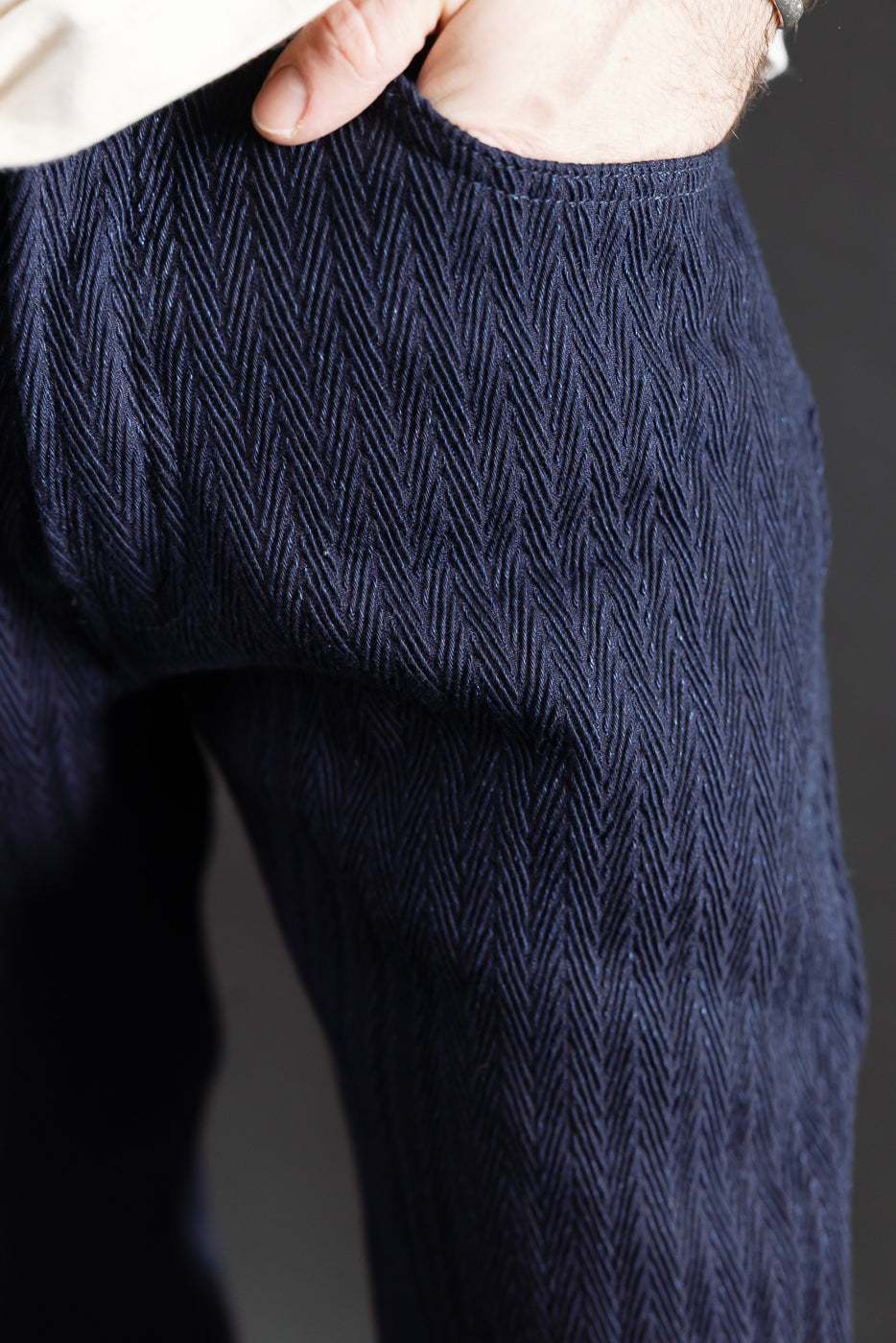 Close-up of male model's right front pocket, indigo herringbone selvedge jeans, Dant