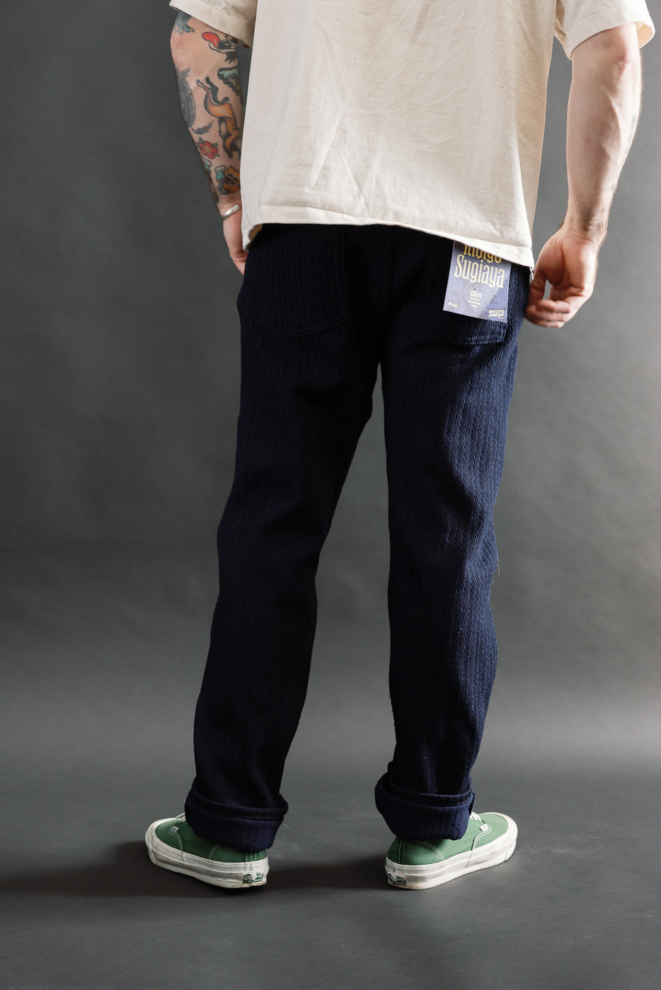 Back view close-up of Naked & Famous 12oz indigo Sugiaya jeans on male model, 5'9