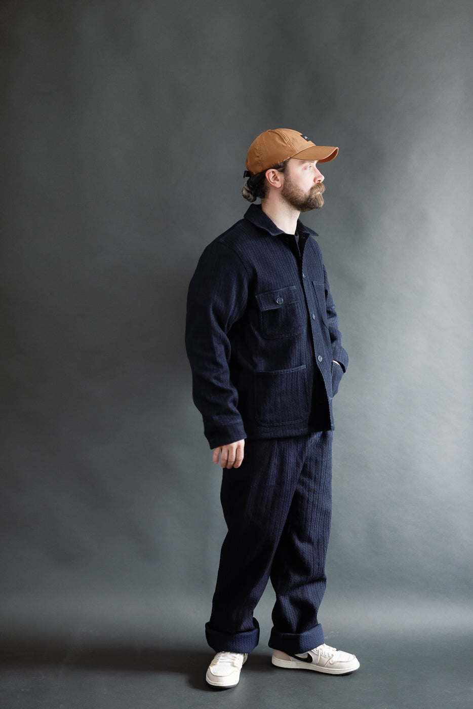 Full body side view of a male model 5'9