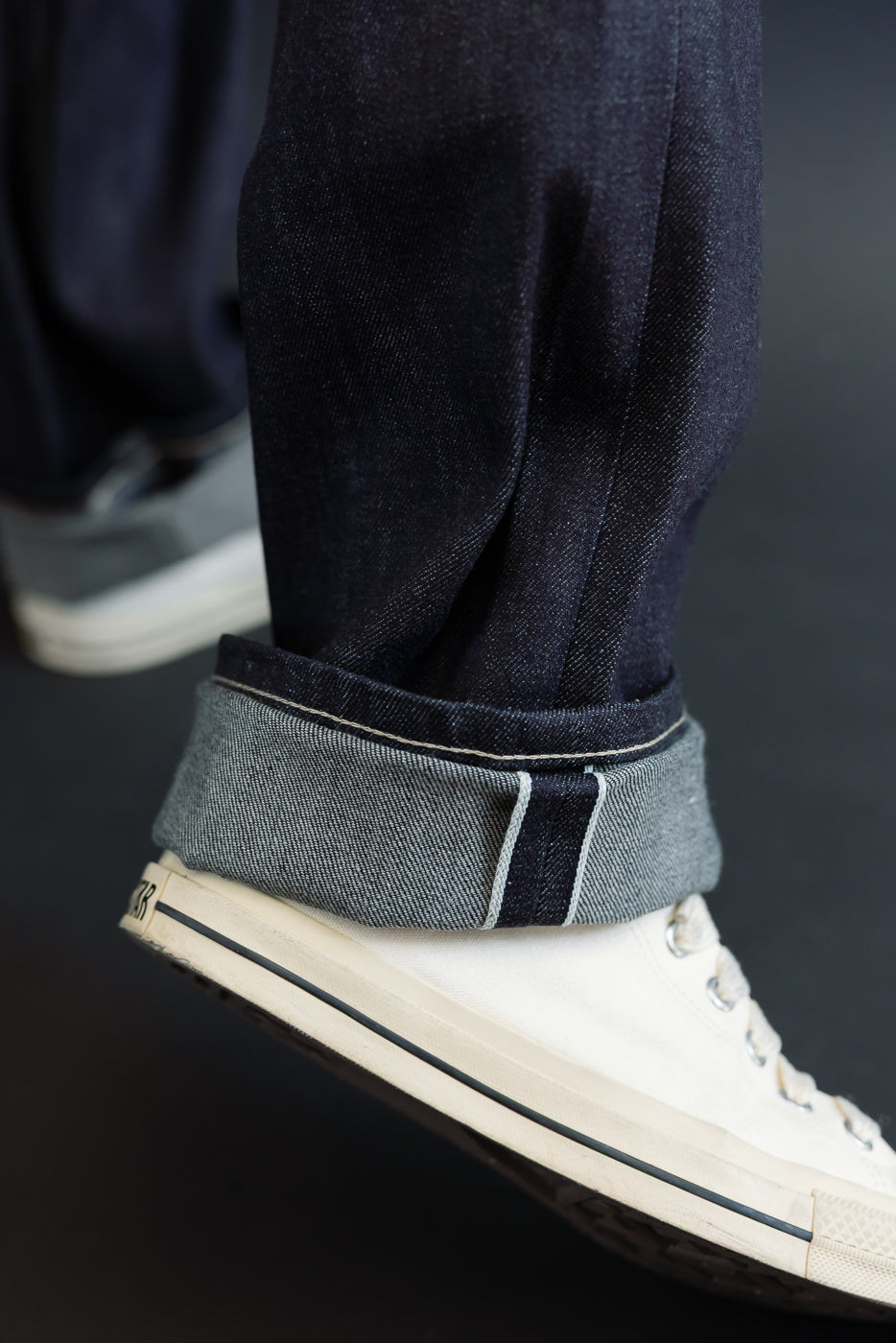 Close-up of cuffed selvedge denim hem on a 5'9