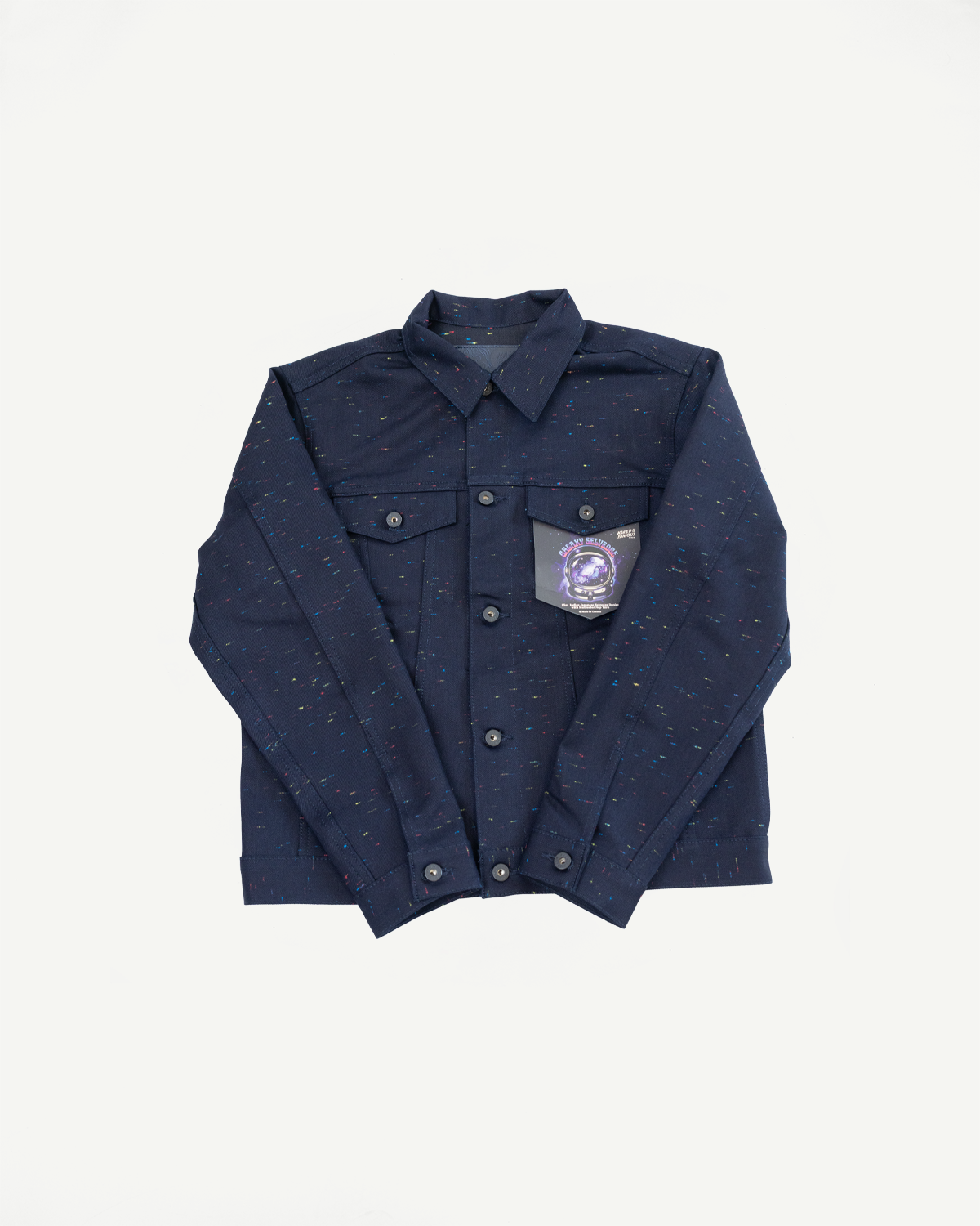 Front view flat lay of a navy blue button-down long sleeve shirt with colorful speckles and a pocket tag.